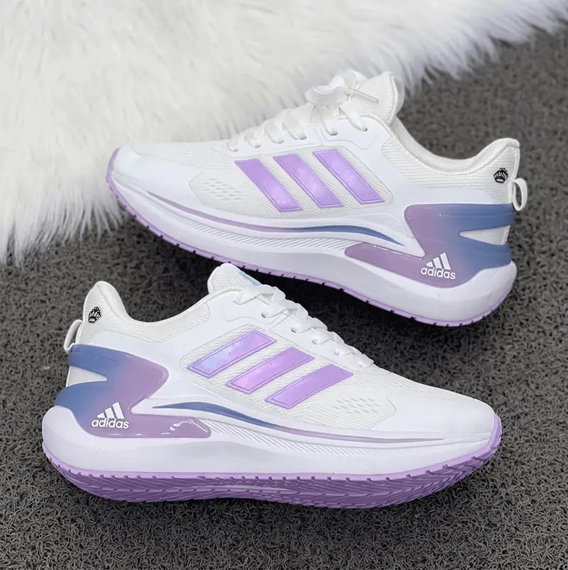 Zapatillas Bounce blancas con acentos lilas, suela con amortiguación y malla transpirable, ideales para running y uso urbano