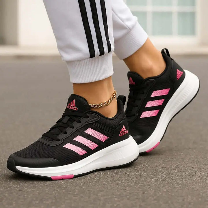 Zapatillas deportivas Falcon negras con detalles en rosa para mujer, diseño ligero y cómodo ideal para correr y actividades diarias, suela antideslizante y transpirable que brinda soporte y amortiguación de alta calidad para mayor rendimiento y estilo.