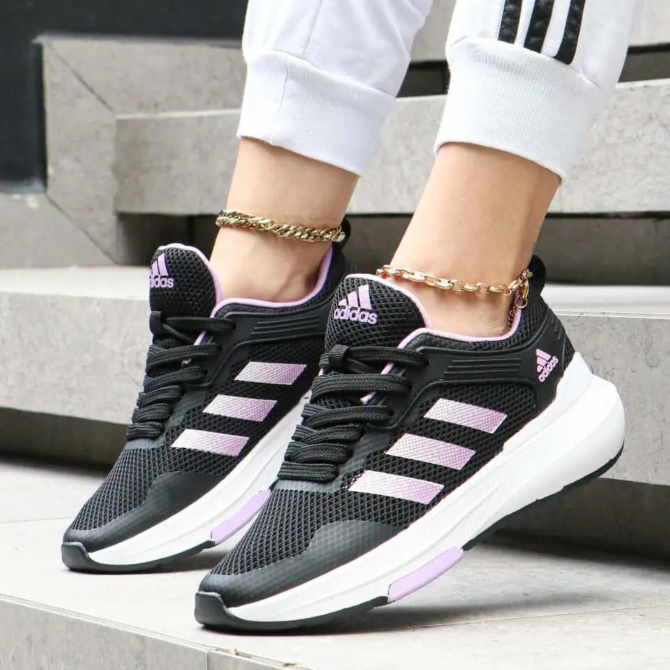 Zapatillas deportivas Falcon negras con detalles en lila, diseño transpirable y ligero ideal para correr y actividades físicas, suela antideslizante que ofrece máxima comodidad y soporte para uso diario, calzado perfecto para mujeres activas que buscan estilo y rendimiento.