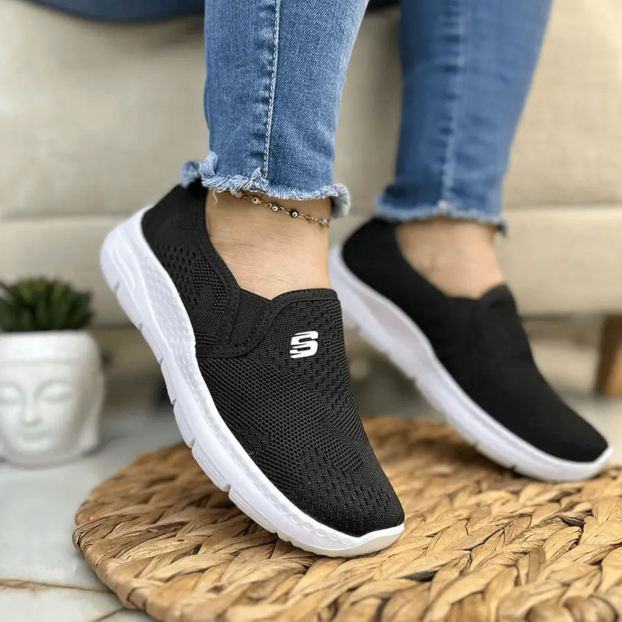 Zapatillas Luna negras de malla transpirable para mujer con suela blanca ligera y antideslizante, diseño slip-on ergonómico que ofrece amortiguación y confort todo el día