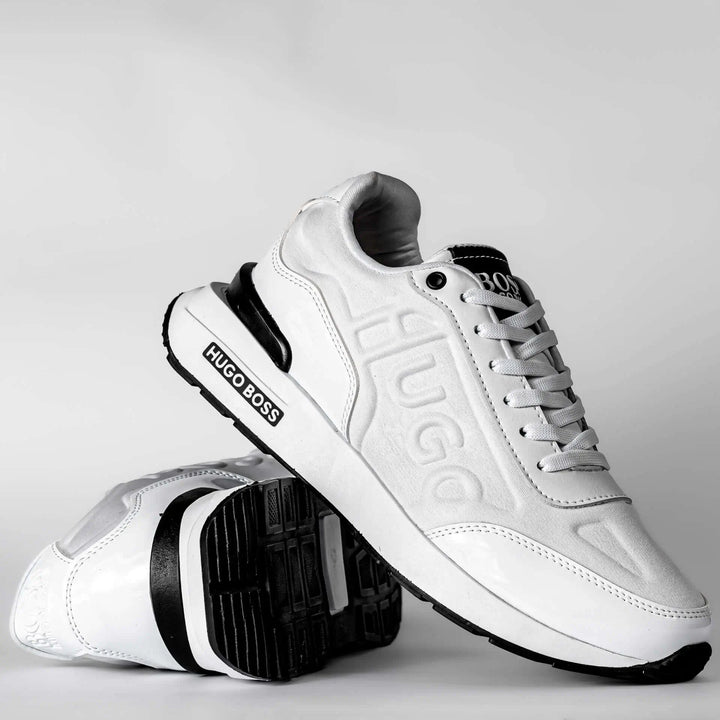 Zapatillas blancas deportivas para hombre con diseño moderno, suela antideslizante y acolchonada para mayor comodidad y soporte en caminatas urbanas, ideales para uso diario y estilo casual.