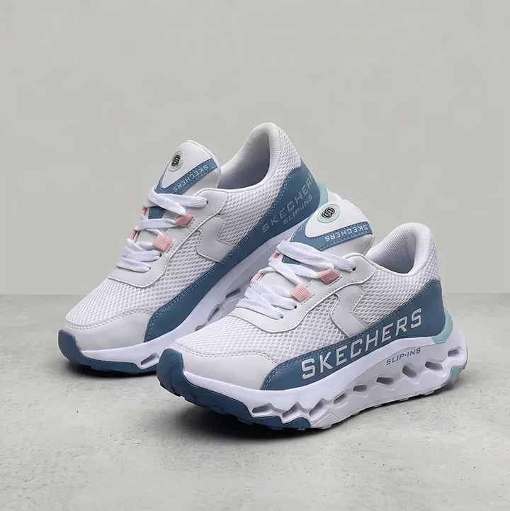 Zapatillas Madrid en blanco y celeste con malla transpirable, entresuela ultraligera con amortiguación superior y suela resistente, ideales para caminar, entrenar y uso diario con confort prolongado.