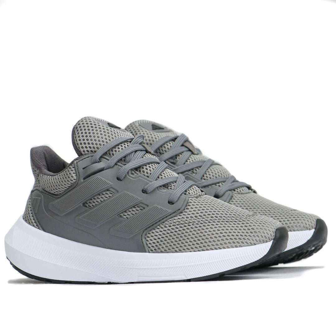 zapatillas deportivas grises con diseño moderno en material transpirable de malla, suela blanca con amortiguación ligera, ideales para correr y uso diario, calzado cómodo y resistente para hombres y mujeres que buscan estilo y funcionalidad en Colombia