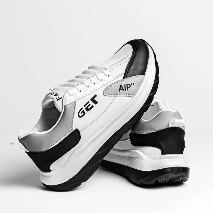 Zapatillas deportivas blancas y negras con suela antideslizante, diseño moderno y cómodo para uso diario, ideales para caminar y correr, materiales durables que ofrecen soporte y amortiguación superior para máxima comodidad y estilo urbano.