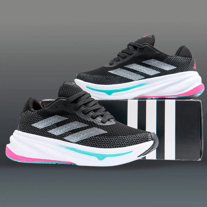 zapatillas deportivas negras con detalles en blanco, turquesa y rosa, diseño ligero y transpirable, suela gruesa para máxima amortiguación y comodidad para correr y caminar, calzado ideal para entrenamiento y uso diario